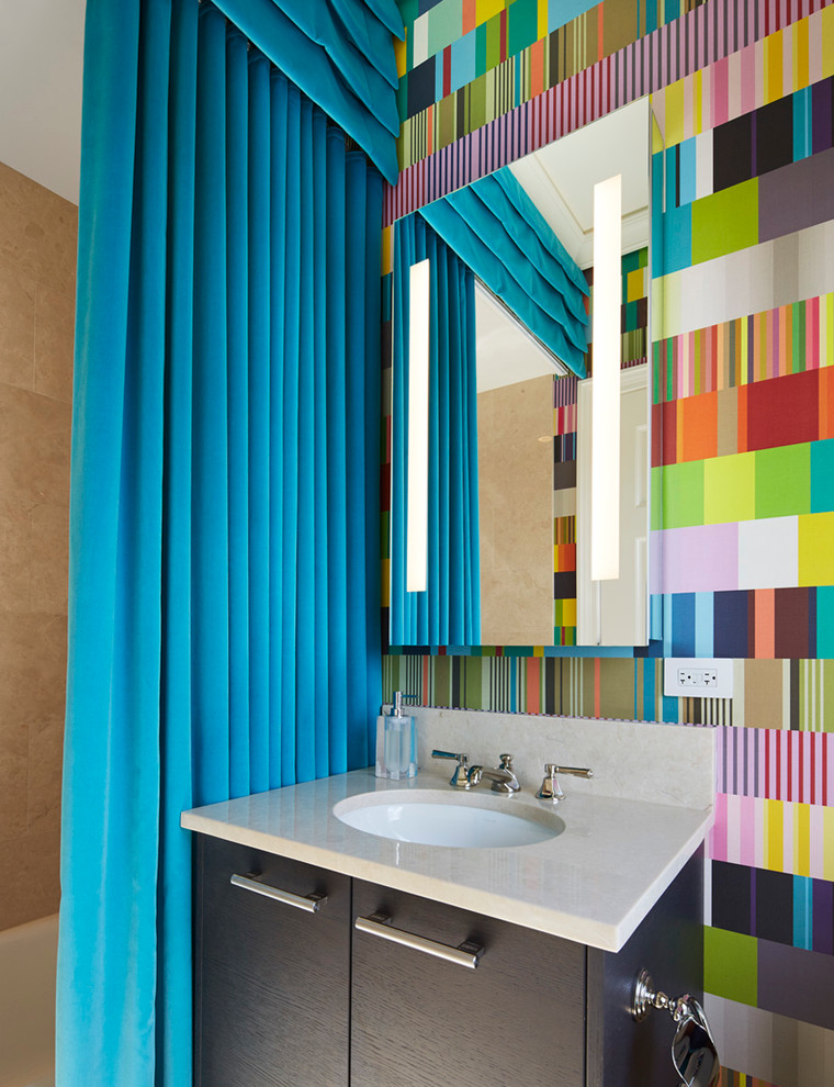 Design ideas for a mid-sized contemporary kids bathroom in Chicago with an undermount sink, flat-panel cabinets, dark wood cabinets, beige tile, multi-coloured walls, a shower curtain, an alcove tub and engineered quartz benchtops.