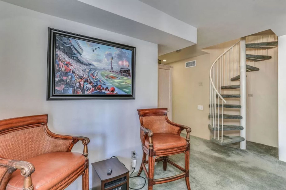 Mid-sized country walk-out basement in San Diego with a game room, white walls, carpet, a standard fireplace, a stone fireplace surround and blue floor.