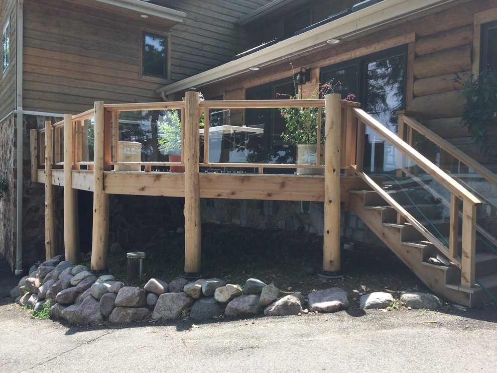 Deck - mid-sized rustic backyard deck idea in Milwaukee with no cover