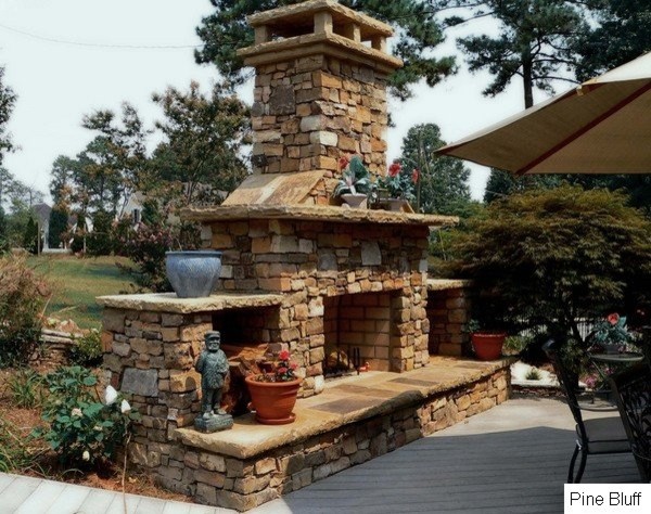 Design ideas for a mid-sized traditional backyard patio in Atlanta with with fireplace, decking and no cover.