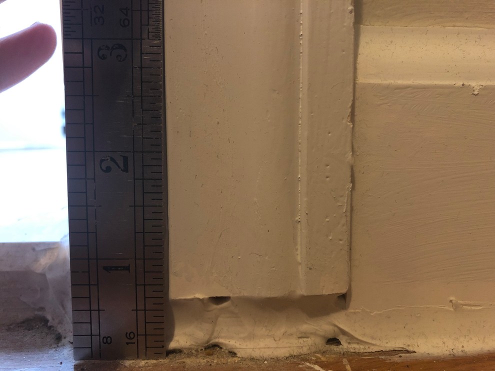Acceptable amount of caulk under door frame