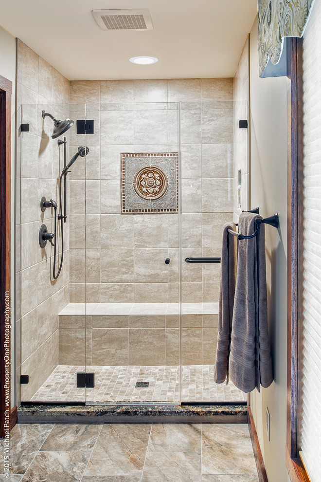 Design ideas for a traditional bathroom in Other with an alcove shower and beige tile.