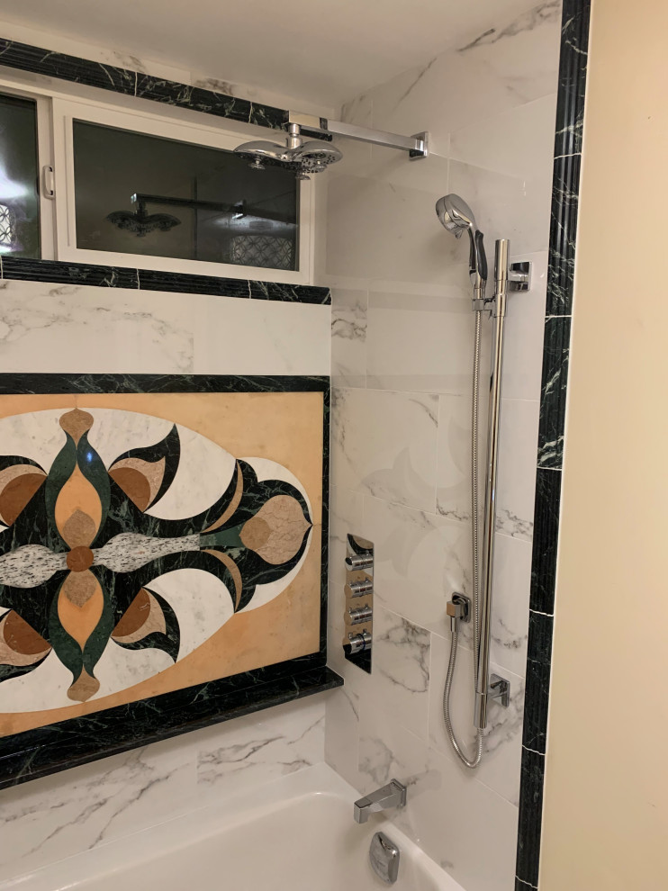 Small master bathroom in Seattle with glass-front cabinets, white cabinets, a shower/bathtub combo, a two-piece toilet, white tile, marble, beige walls, porcelain floors, an undermount sink, marble benchtops, white floor, white benchtops, a single vanity and a freestanding vanity.