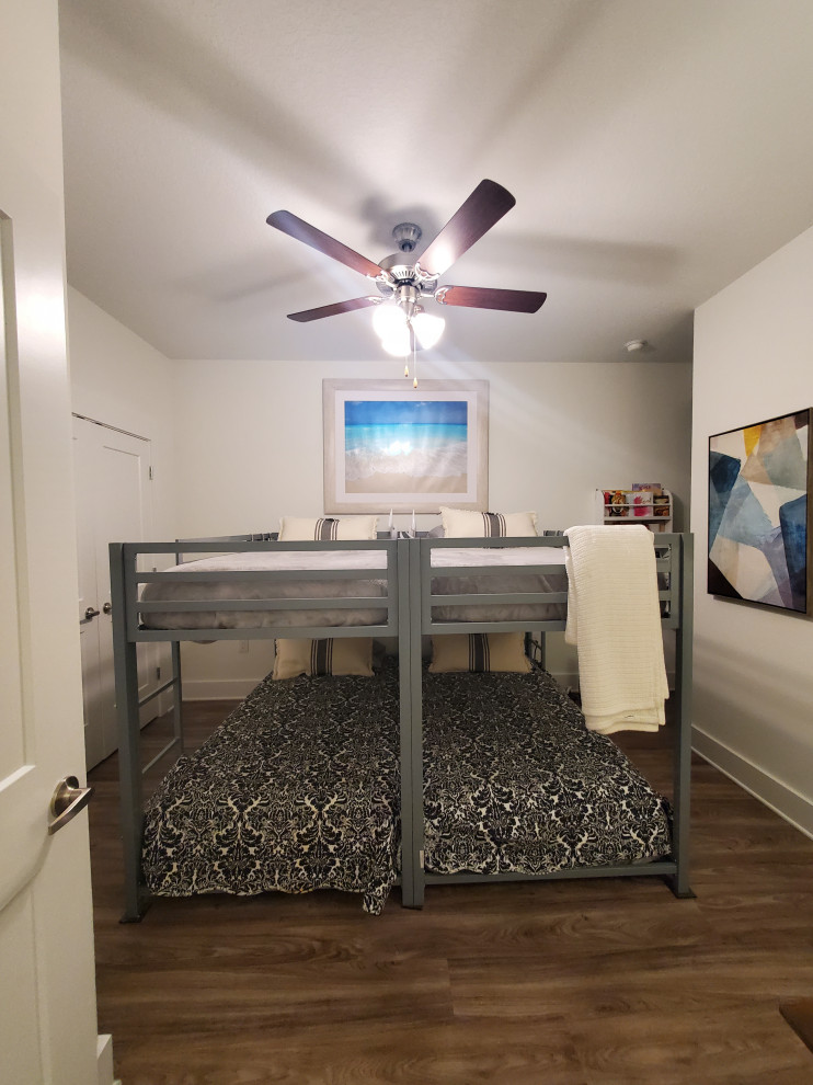 Inspiration for a mid-sized transitional guest vinyl floor and beige floor bedroom remodel with white walls