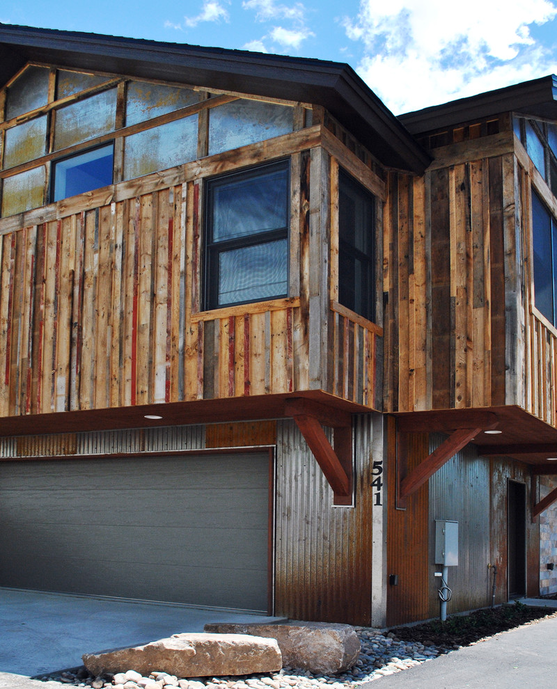 This is an example of a contemporary three-storey exterior in Albuquerque with mixed siding.
