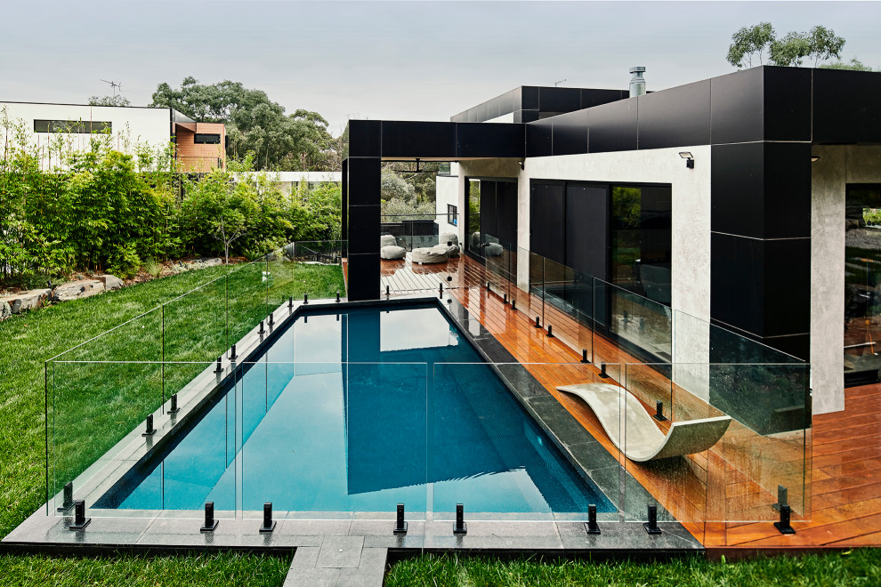Inspiration for a contemporary custom-shaped pool in Melbourne with decking.