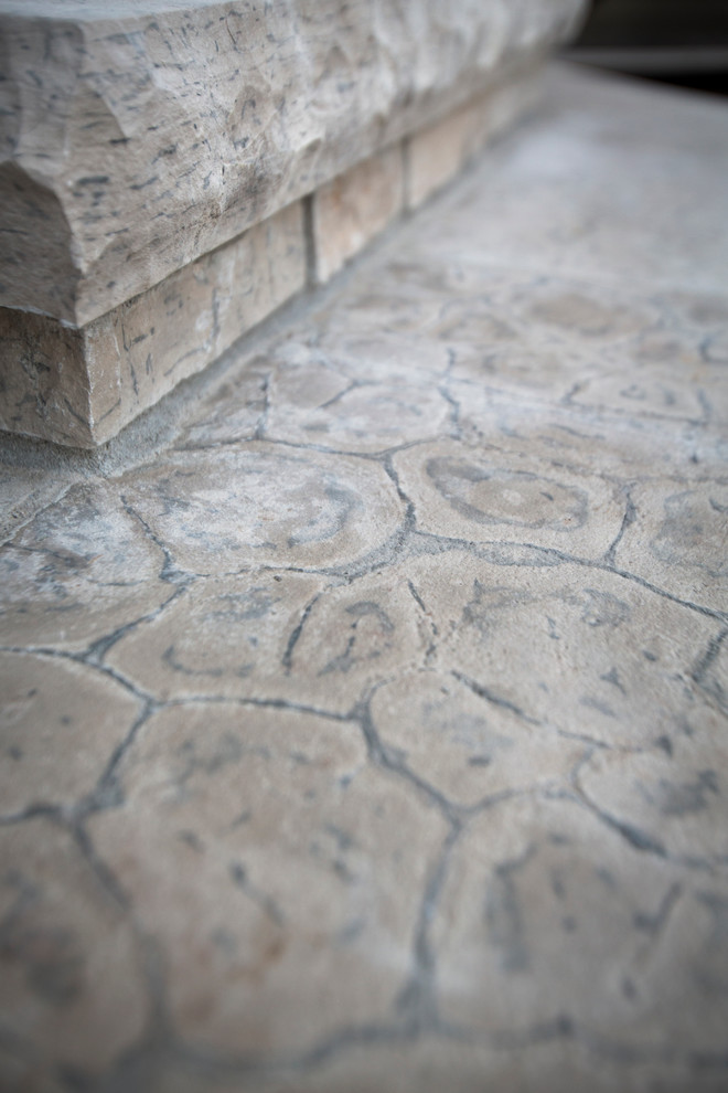 Design ideas for a transitional backyard stone water fountain landscape in Omaha.