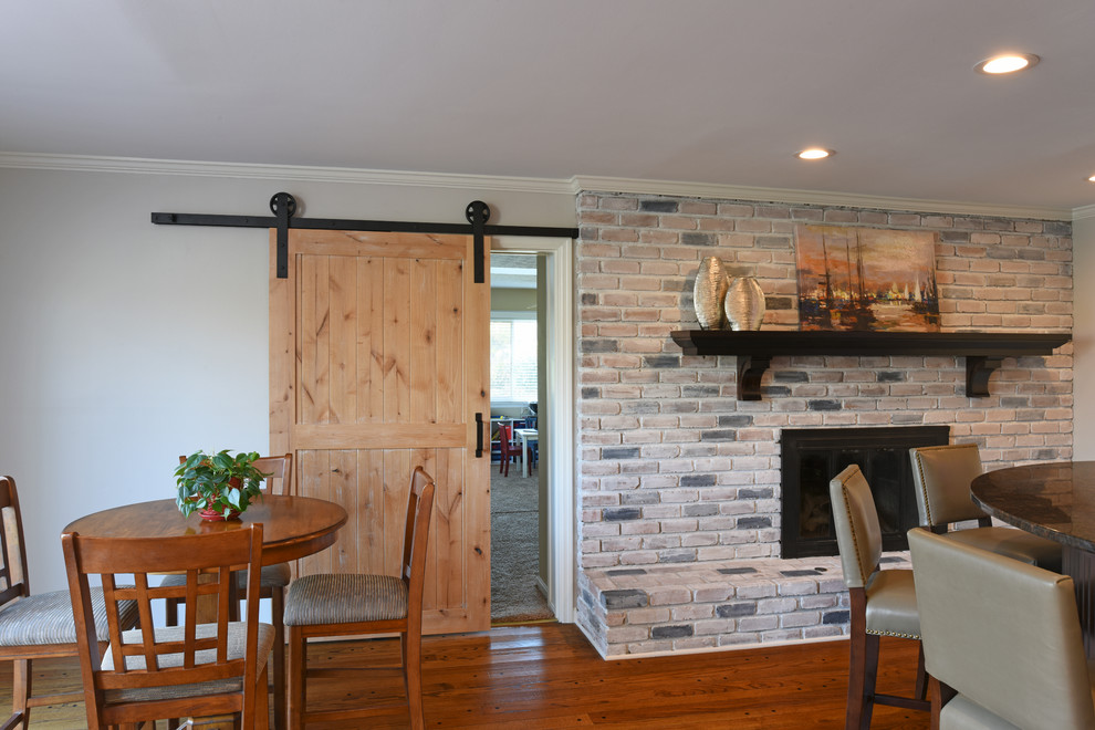 Home design - transitional u-shaped medium tone wood floor home design idea in Orange County with an undermount sink, shaker cabinets, dark wood cabinets, granite countertops, gray backsplash and ceramic backsplash