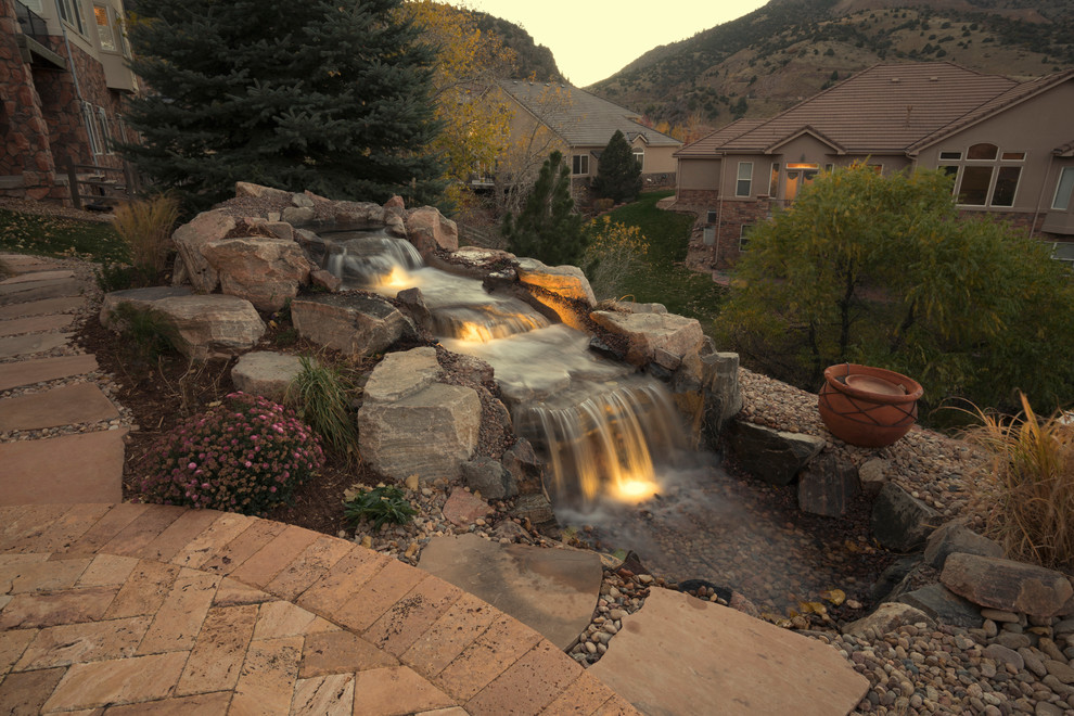 Inspiration for a rustic landscaping in Denver.