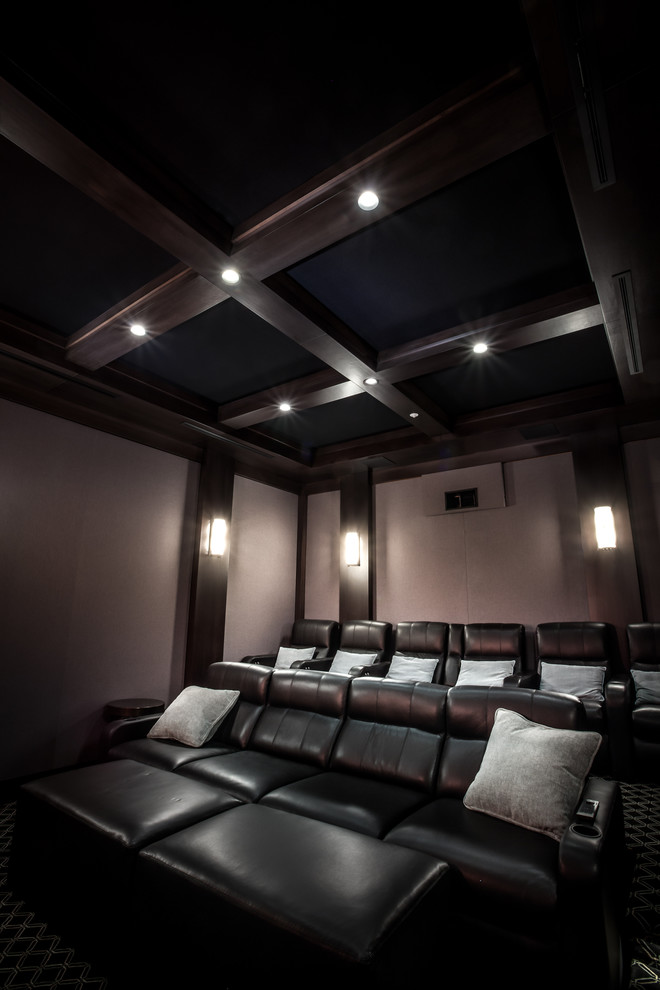 Large contemporary enclosed home theatre in Los Angeles with brown walls, carpet and a projector screen.