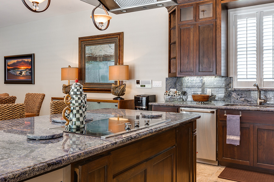 Mid-sized transitional travertine floor eat-in kitchen photo in Austin with an undermount sink, granite countertops, stainless steel appliances and an island