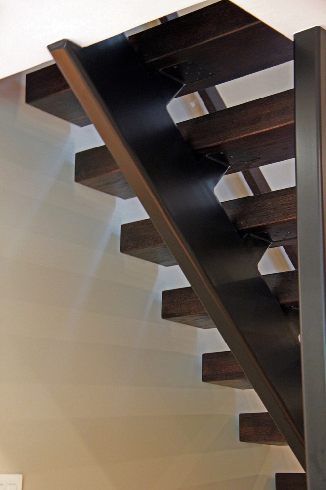 Example of a large trendy wooden floating staircase design in DC Metro