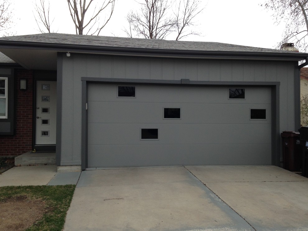 Design ideas for a mid-sized midcentury attached two-car garage in Denver.