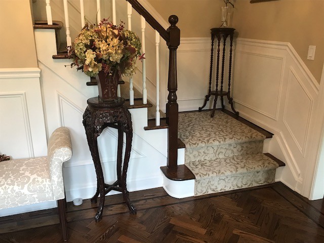 Mid-sized traditional wood straight staircase in New York with wood risers and wood railing.