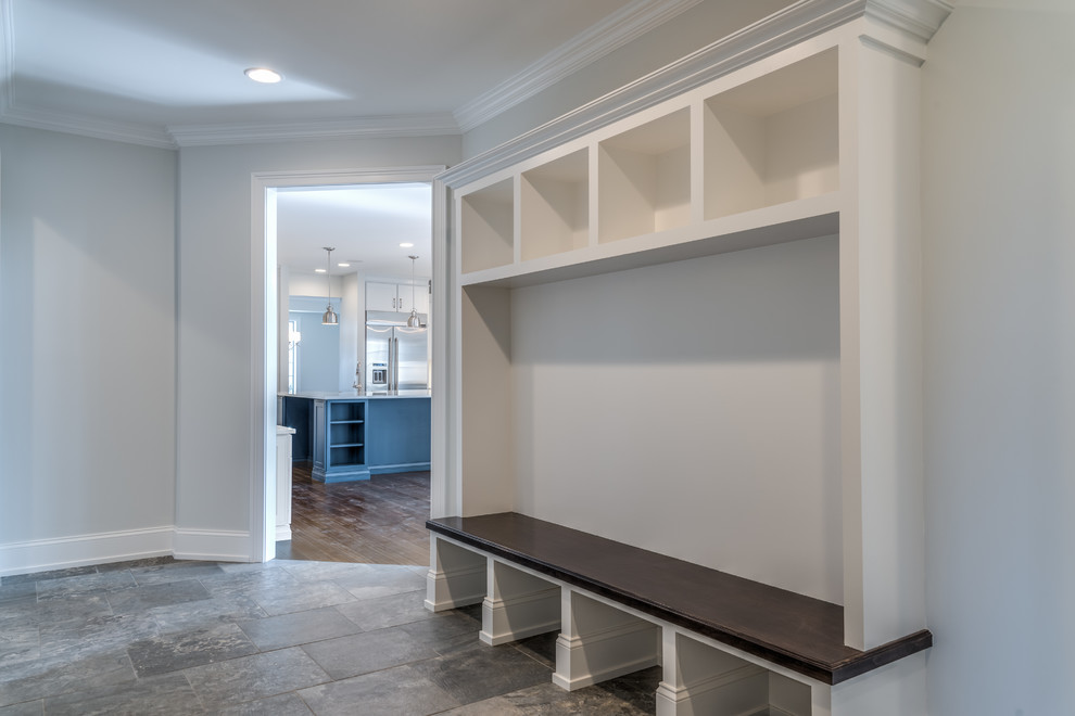 Mid-sized transitional ceramic tile and gray floor mudroom photo with gray walls