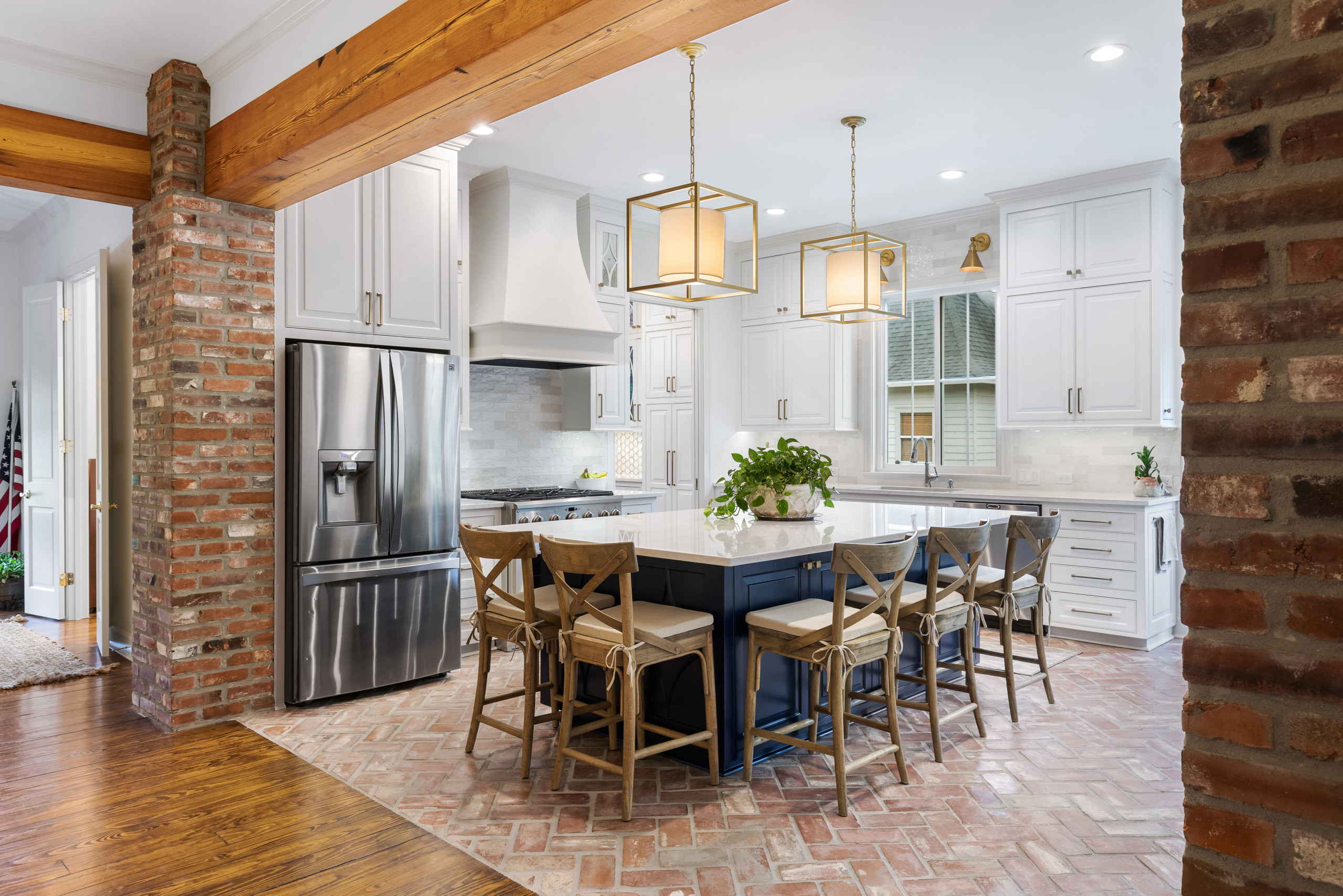 Large elegant l-shaped brick floor and red floor open concept kitchen photo in New Orleans with an undermount sink, raised-panel cabinets, white cabinets, quartzite countertops, gray backsplash, ceram
