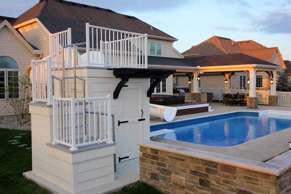 Large transitional backyard rectangular natural home design photo with decking