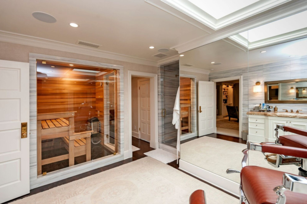 Photo of a large transitional bathroom in Los Angeles with recessed-panel cabinets, white cabinets and with a sauna.