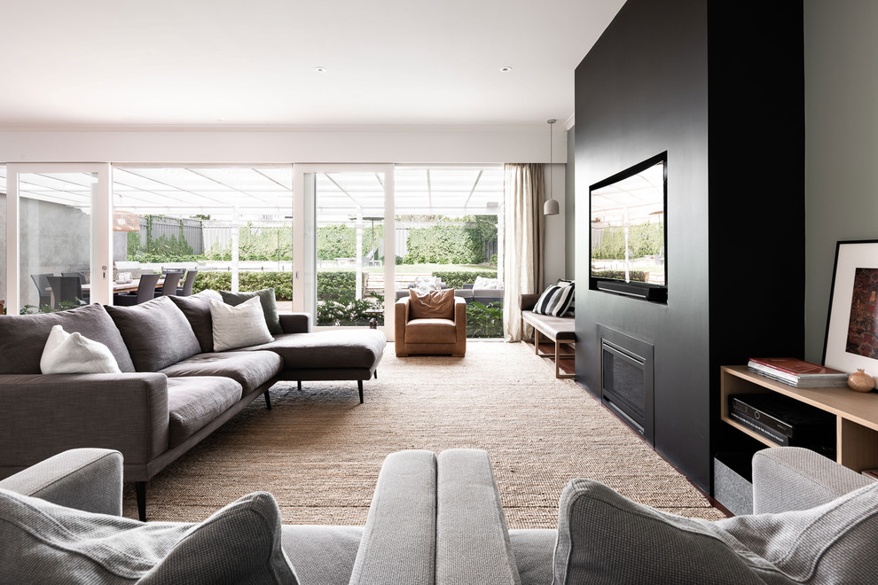 Contemporary formal open concept living room in Perth with grey walls, medium hardwood floors, a ribbon fireplace, a built-in media wall and brown floor.