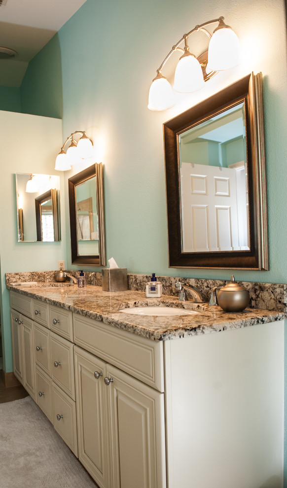 Inspiration for a mid-sized transitional master beige tile and ceramic tile ceramic tile alcove shower remodel in Miami with raised-panel cabinets, white cabinets, a two-piece toilet, blue walls, an undermount sink and granite countertops