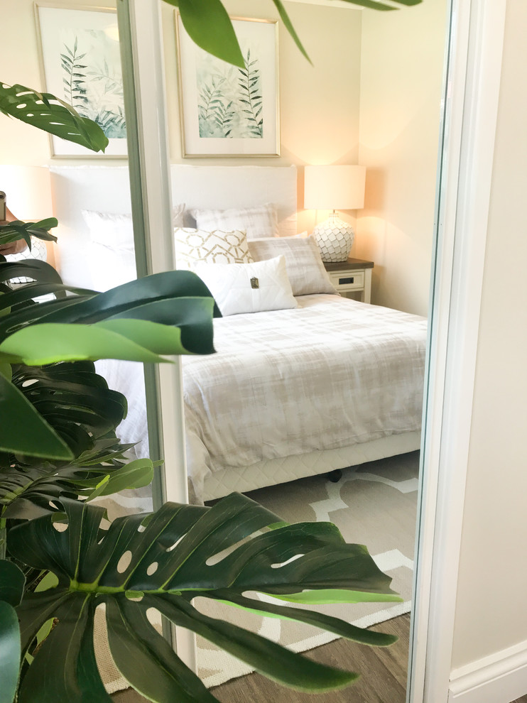Mid-sized traditional master bedroom in Gold Coast - Tweed with beige walls, vinyl floors and brown floor.