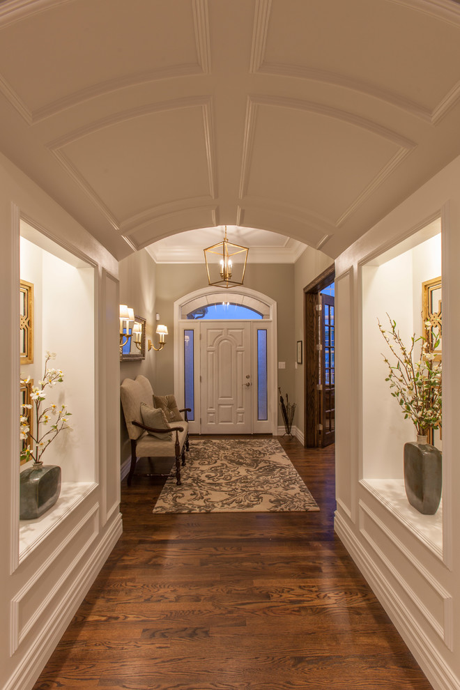 Expansive contemporary entryway in St Louis with brown walls.
