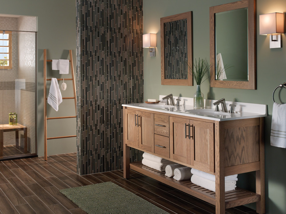 Design ideas for a contemporary master bathroom in Raleigh with a drop-in sink, recessed-panel cabinets, light wood cabinets, a curbless shower, multi-coloured tile, matchstick tile, green walls and dark hardwood floors.
