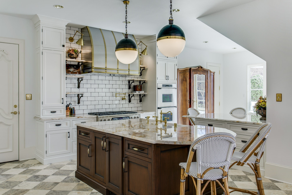 Inspiration for a large traditional open plan kitchen in Dallas with beaded inset cabinets, white cabinets, quartzite benchtops, white splashback, ceramic splashback, stainless steel appliances, marble floors and multiple islands.