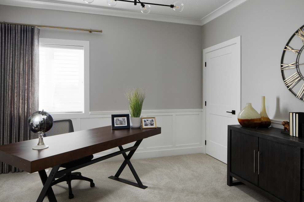 Photo of a mid-sized transitional study room in Edmonton with grey walls, carpet, a freestanding desk, grey floor and decorative wall panelling.