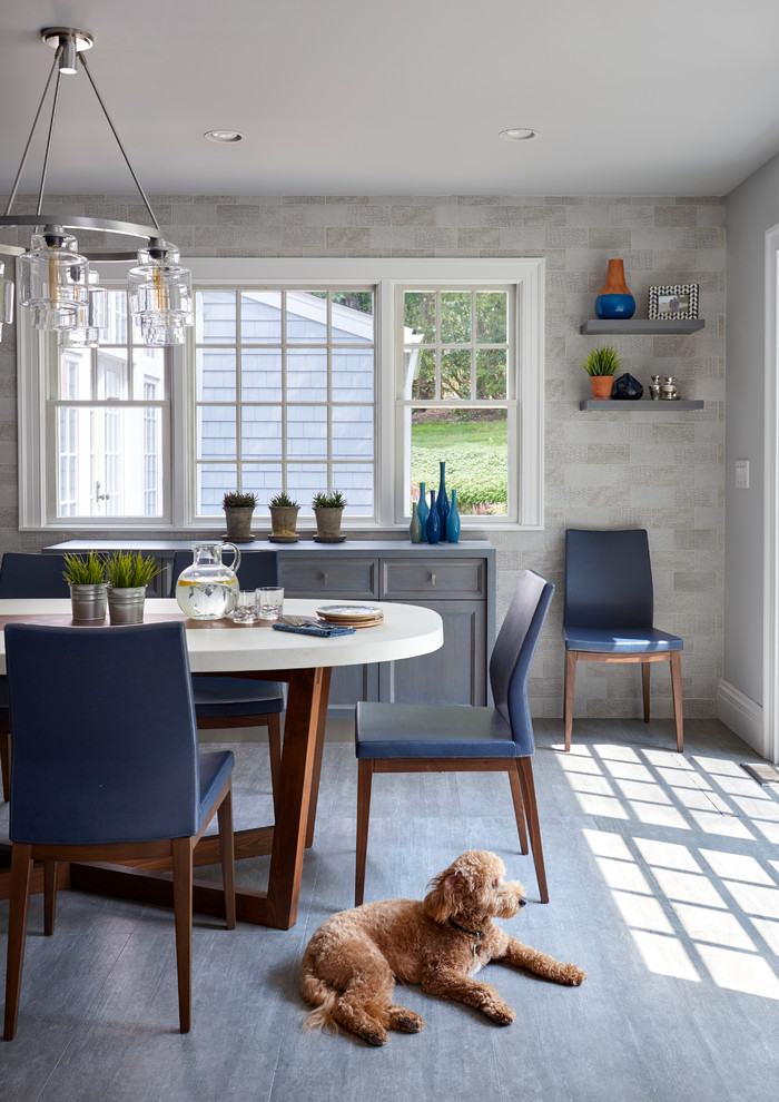 Inspiration for a large transitional u-shaped porcelain tile kitchen/dining room combo remodel in New York with a farmhouse sink, recessed-panel cabinets, light wood cabinets, quartzite countertops, gray backsplash, ceramic backsplash, paneled appliances, an island and gray walls