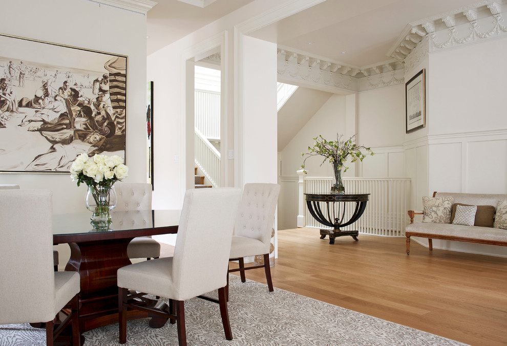 Design ideas for a large traditional hallway in Montreal with white walls and light hardwood floors.