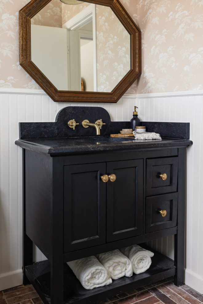 Inspiration for a small transitional 3/4 bathroom in Dallas with black cabinets, white tile, pink walls, brick floors, brown floor, a single vanity, a built-in vanity and wallpaper.