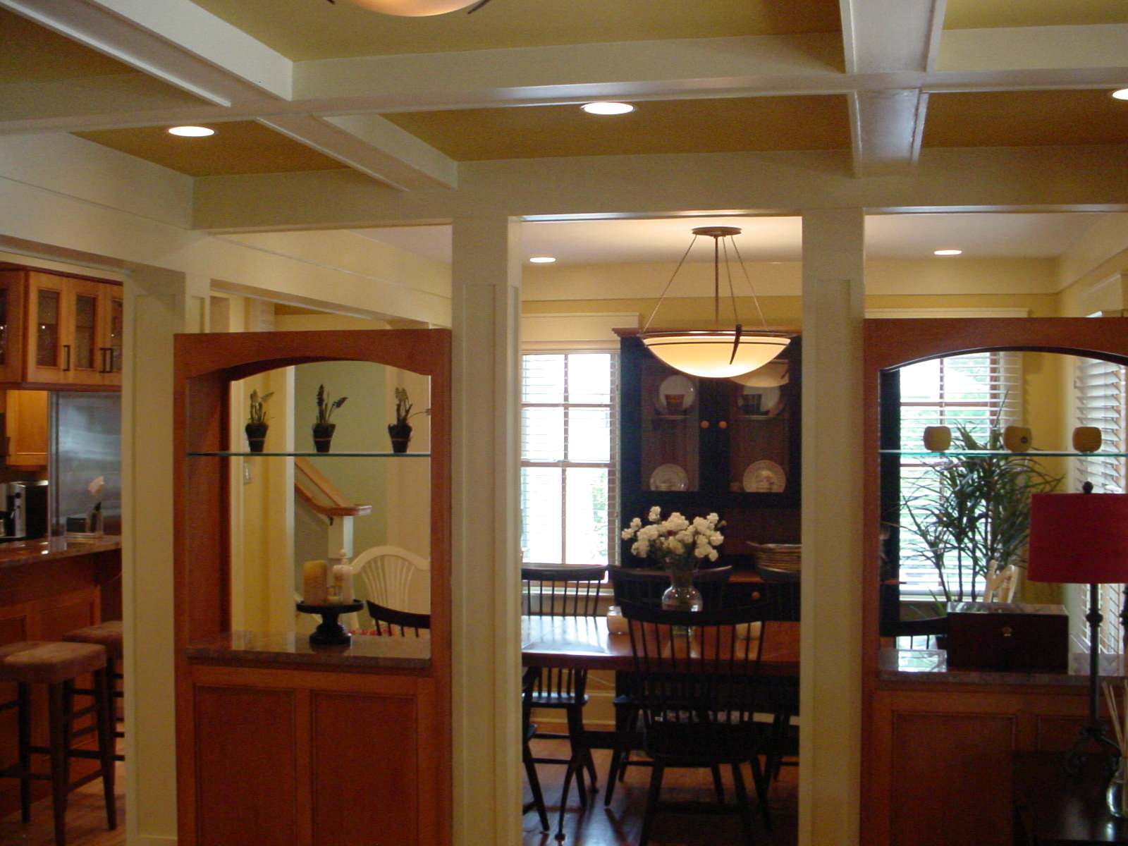 Coffering, open Cabinets and period lighting detail the interior