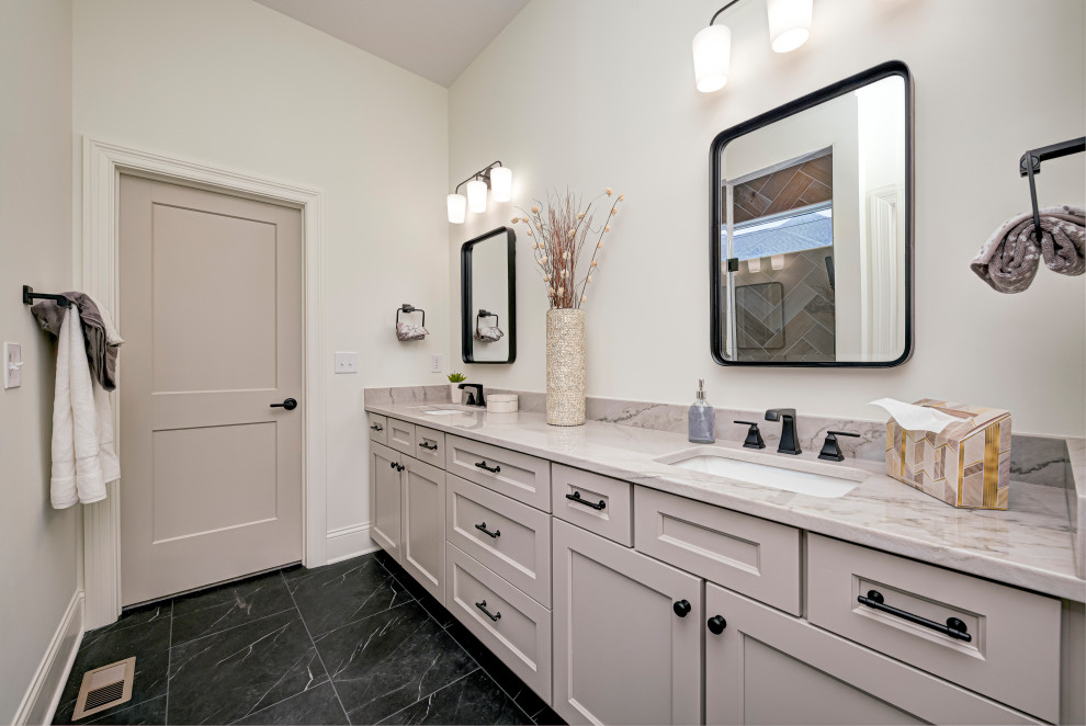 Inspiration for a mid-sized transitional 3/4 vinyl floor, black floor and double-sink walk-in shower remodel in Indianapolis with shaker cabinets, beige cabinets, white walls, a drop-in sink, granite countertops, a hinged shower door, gray countertops and a built-in vanity
