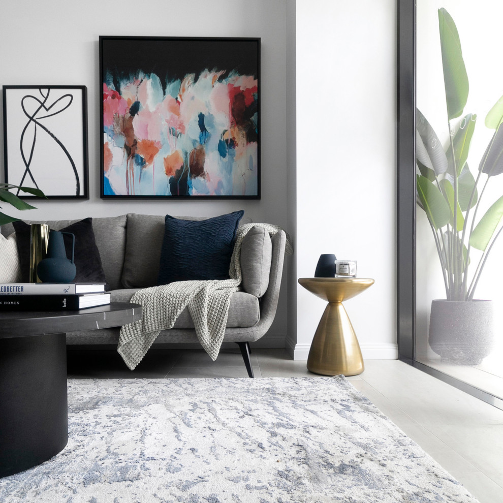 This is an example of a mid-sized contemporary open concept living room in Sydney with grey walls and grey floor.