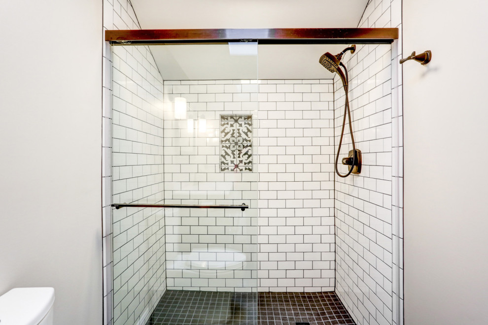 This is an example of a small modern master bathroom in Other with brown cabinets, an alcove shower, a two-piece toilet, white tile, ceramic tile, grey walls, vinyl floors, an integrated sink, marble benchtops, brown floor, a sliding shower screen, white benchtops, a single vanity and a freestanding vanity.