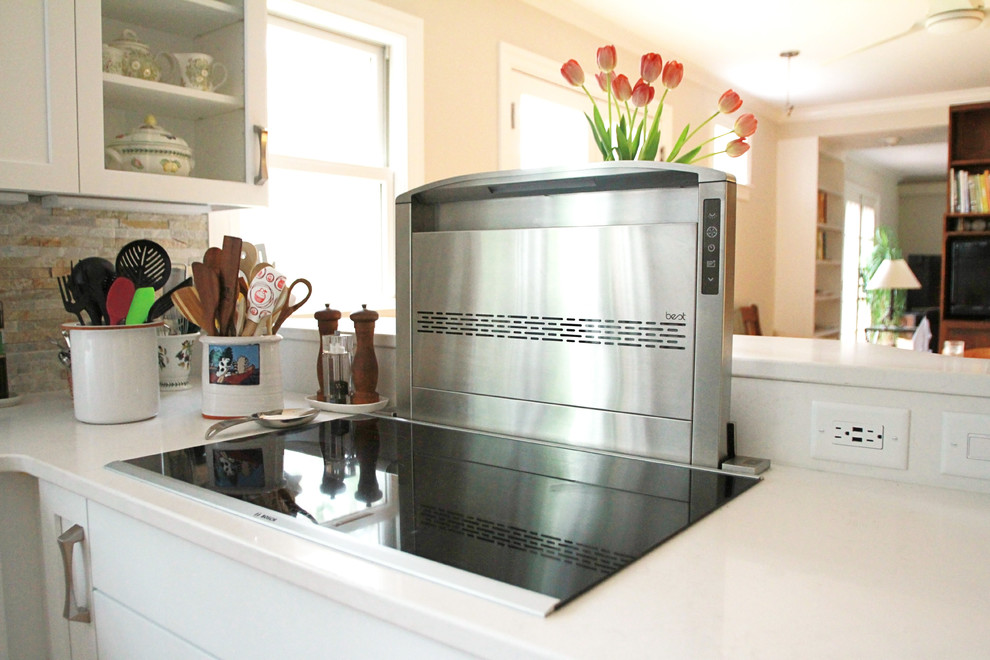 Eat-in kitchen - mid-sized transitional u-shaped eat-in kitchen idea with flat-panel cabinets, white cabinets and a peninsula