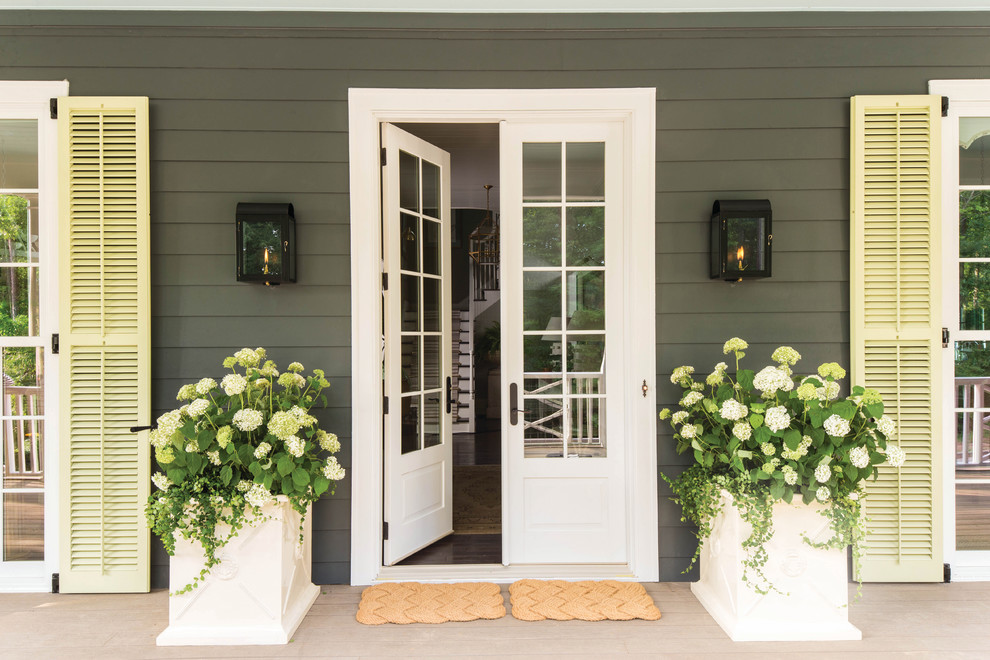 Inspiration for a large traditional verandah in Portland Maine with a container garden.
