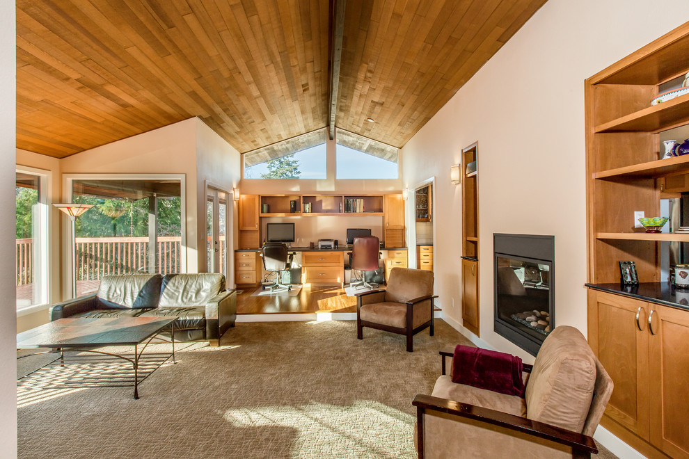 Photo of a large midcentury open concept living room in Seattle with white walls, a two-sided fireplace, a metal fireplace surround, a library, carpet and grey floor.