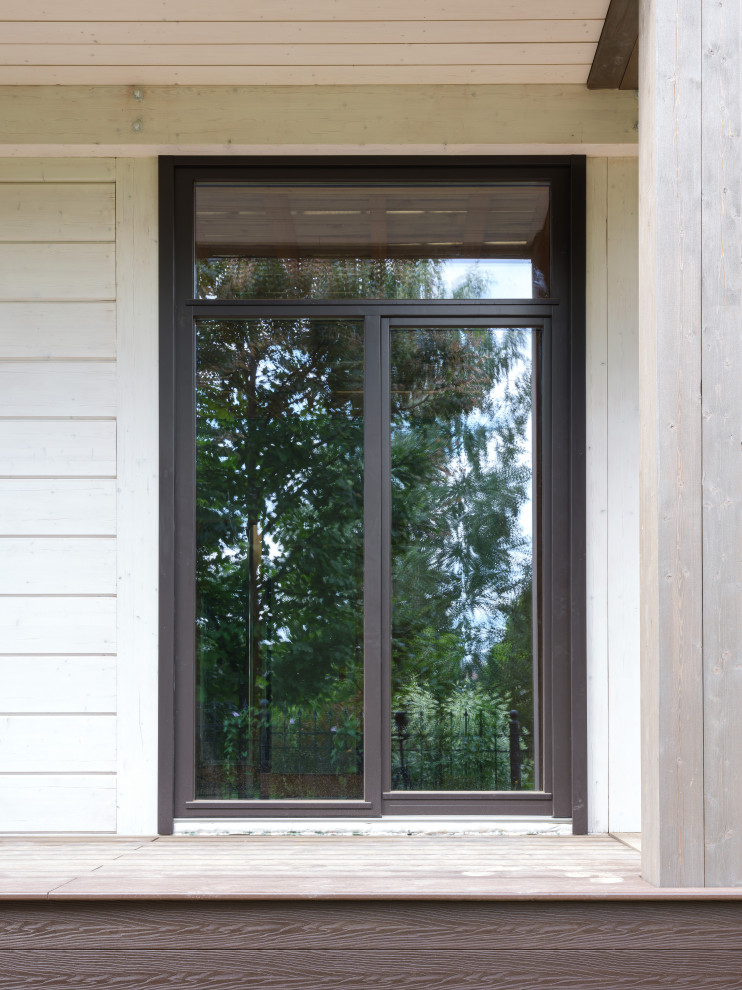 Трапецевидные окна, порталы и входные двери для современного дома