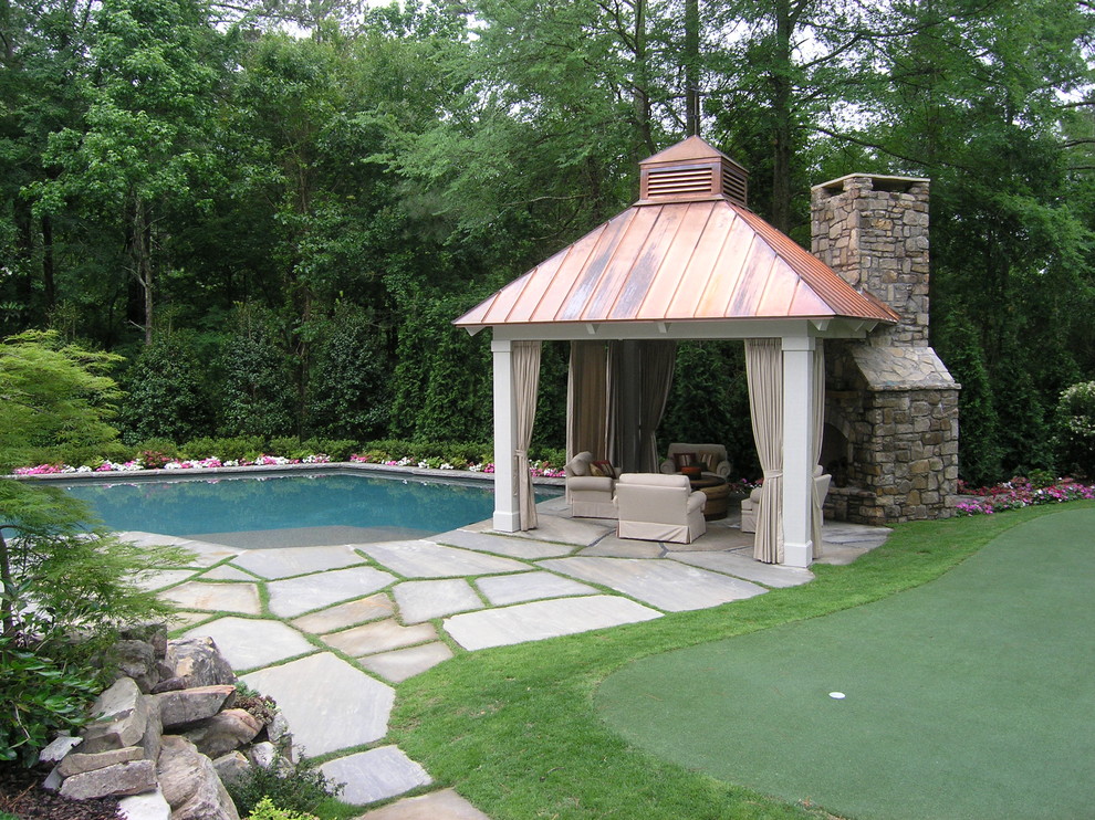 This is an example of a traditional garden in Atlanta with a fire feature.
