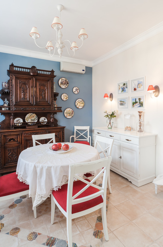 Photo of a mid-sized country dining room in Moscow with blue walls and ceramic floors.