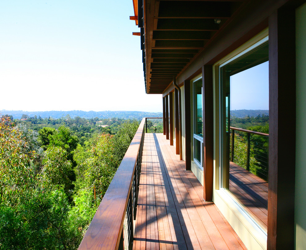 Large midcentury backyard deck in Santa Barbara with a roof extension.