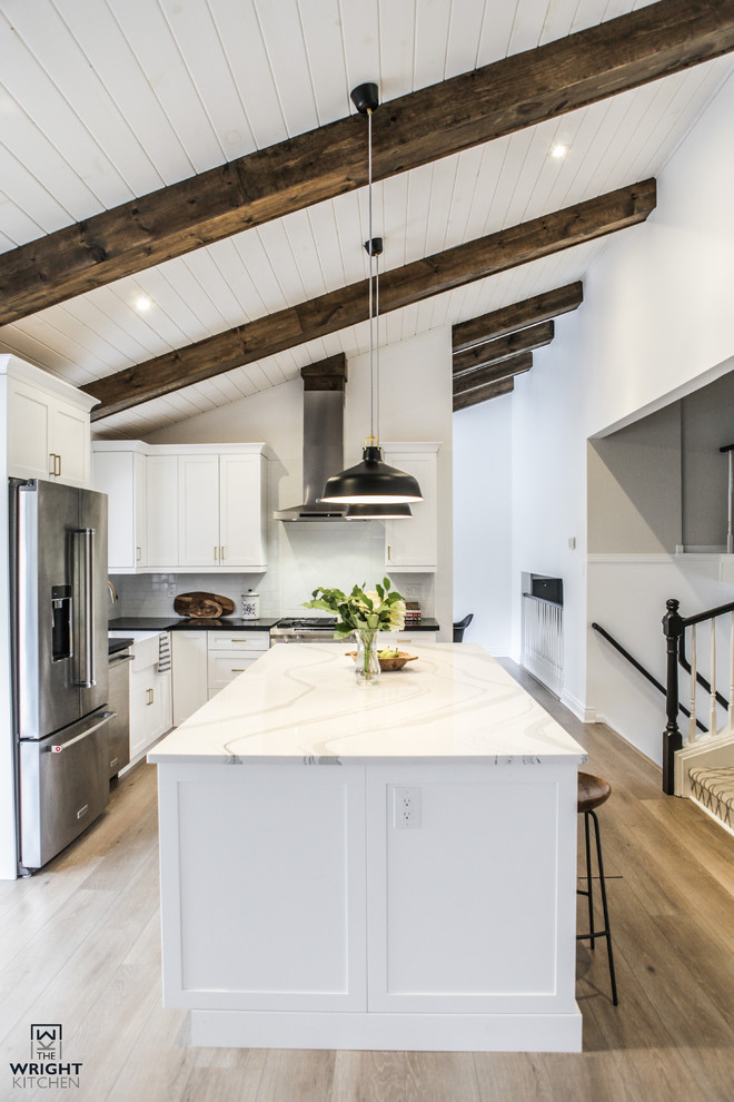 Example of a transitional kitchen design in Toronto
