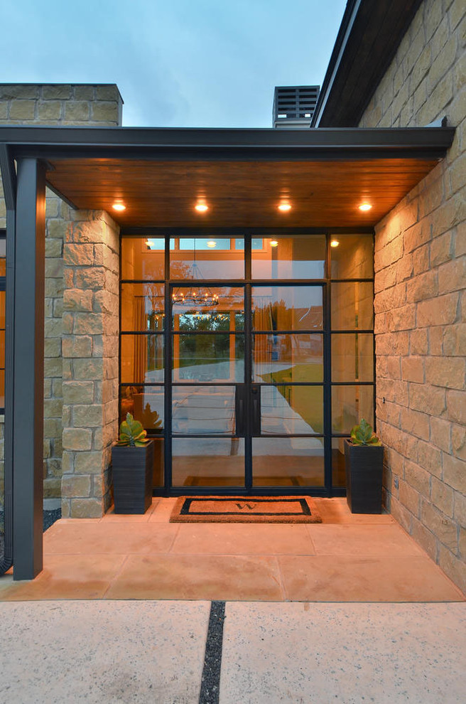 Photo of a contemporary front door in Austin with a double front door and a glass front door.