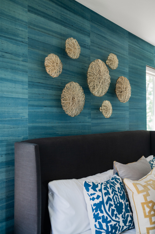 Example of a trendy master bedroom design in Cedar Rapids with blue walls