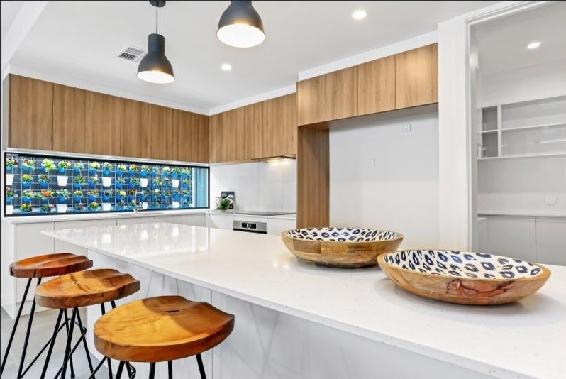 Design ideas for a large contemporary l-shaped open plan kitchen in Adelaide with quartzite benchtops, white splashback, ceramic splashback, porcelain floors, with island and brown floor.
