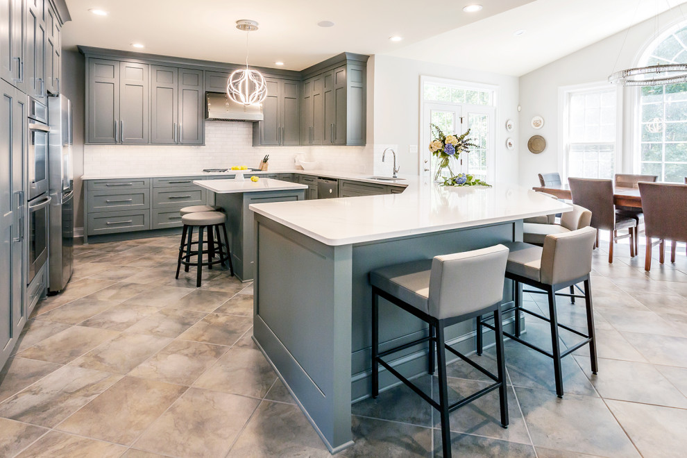 Inspiration for a large transitional u-shaped ceramic tile and gray floor eat-in kitchen remodel in Richmond with an undermount sink, gray cabinets, granite countertops, red backsplash, stainless steel appliances, an island and white countertops