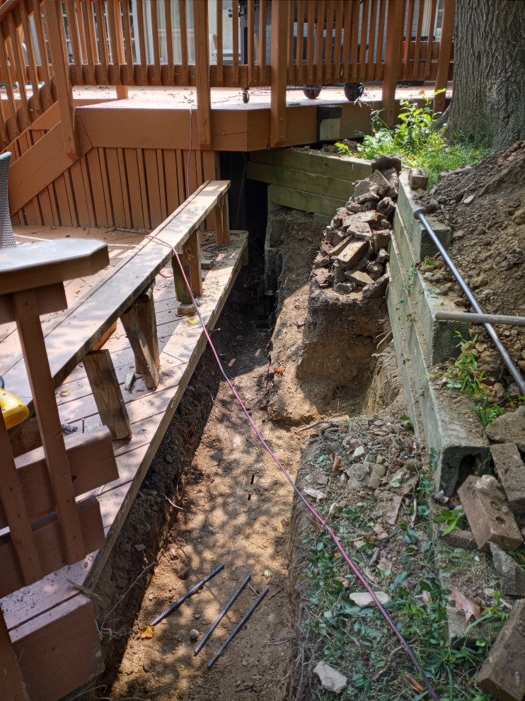 STONE FIREPLACE  , BBQ GRILL   AND STONE RETAINING WALL
