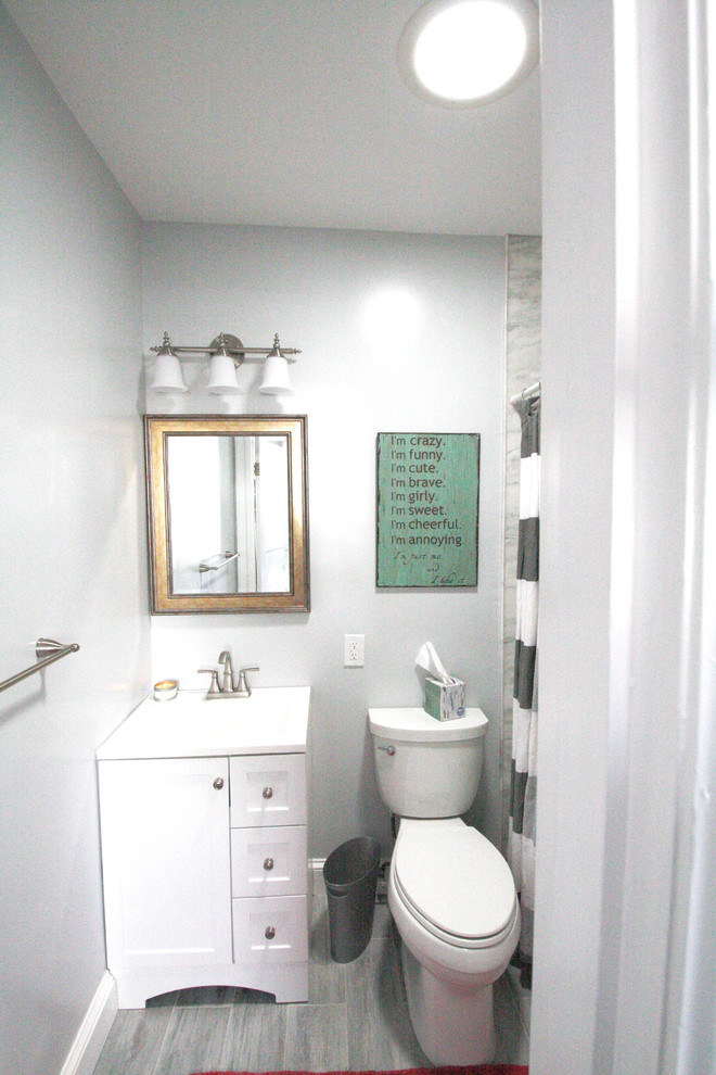 Design ideas for a mid-sized traditional kids bathroom in DC Metro with flat-panel cabinets, beige cabinets, an alcove shower, a one-piece toilet, ceramic floors, an integrated sink, engineered quartz benchtops and beige floor.